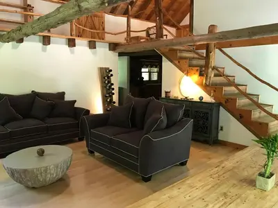 a living room with two couches and a table at Roscoe Retreat in Roscoe