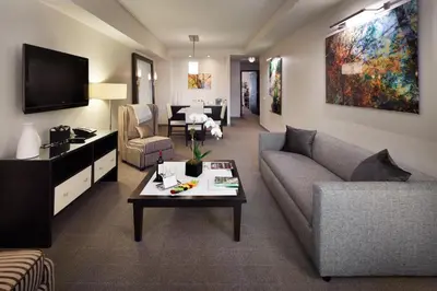 a living room with a couch and a table at Royalton Park Avenue in New York