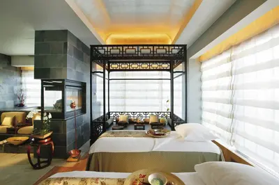 a bedroom with two beds and a large window at Mandarin Oriental, New York in New York