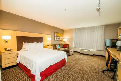 a hotel room with a bed and a desk at TownePlace Suites by Marriott Scranton Wilkes-Barre in Moosic