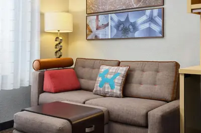 a living room with a couch and a table at TownePlace Suites by Marriott Scranton Wilkes-Barre in Moosic