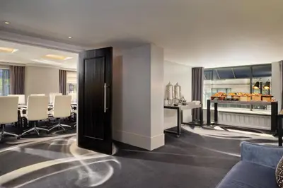 a conference room with a table and chairs at Loews Regency New York Hotel in New York