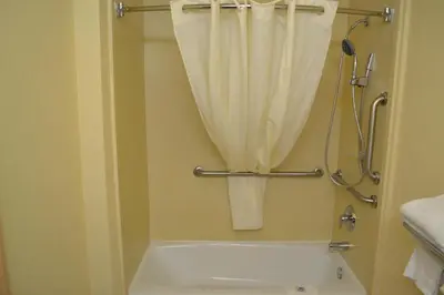 a bathroom with a shower curtain and a bath tub at Red Carpet Inn Newark - Irvington NJ in Irvington
