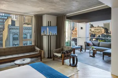 a hotel room with a view of a city at MADE Hotel in New York