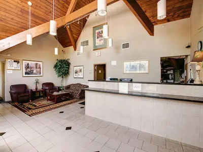 a lobby with a bar and a living room at Red Carpet INN Whippany in Whippany