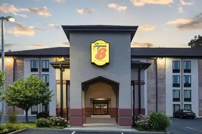 a hotel with a sign on the side of a building at Super 8 by Wyndham Mount Laurel in Mount Laurel