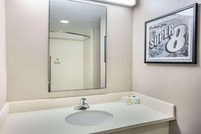 a bathroom with a sink and a mirror at Super 8 by Wyndham Mount Laurel in Mount Laurel