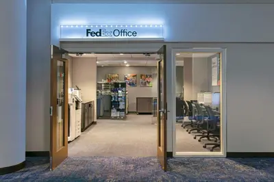 an office with a sign that reads fedex office at New York Marriott Marquis in New York