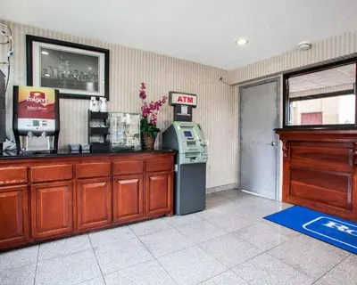 a restaurant with an atm machine in a room at Rodeway Inn Paterson Great Falls Park Area in Paterson