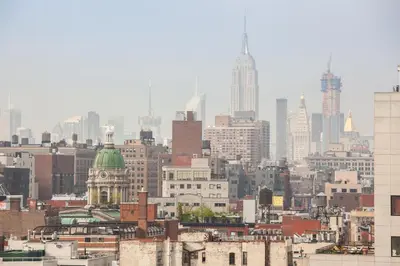a view of a city skyline with buildings at Hotel Mulberry in New York