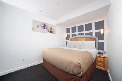 a bedroom with a large bed in a room at Hotel Mulberry in New York