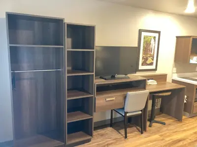 an office with a desk and a desk and a chair at Woodspring Suites Cherry Hill in Cherry Hill