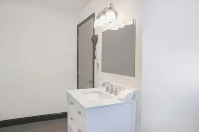 a bathroom with a sink and a mirror at The Lancaster Motel By OYO Ronks near Paradise in Ronks