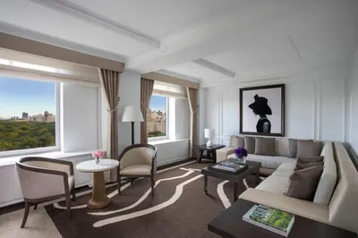 a living room with a couch and a table at The Ritz-Carlton New York, Central Park in New York