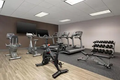 a gym with treadmills and cardio equipment in a room at Hampton Inn & Suites Wilkes-Barre in Wilkes-Barre