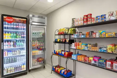 a grocery store aisle with a soda refrigerator at La Quinta by Wyndham Mt. Laurel - Philadelphia in Mount Laurel