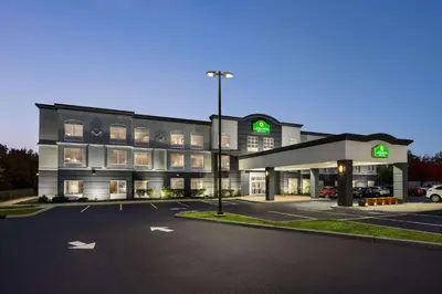 a building with a parking lot in front of it at La Quinta by Wyndham Mt. Laurel - Philadelphia in Mount Laurel