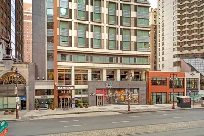 an empty street in a city with tall buildings at Cambria Hotel Philadelphia Downtown - Center City in Philadelphia