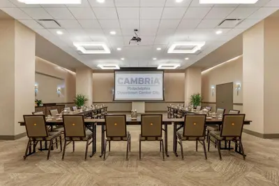 a conference room with a long table and chairs at Cambria Hotel Philadelphia Downtown - Center City in Philadelphia