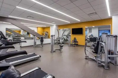 a gym with several treadmills and cardio machines at Cambria Hotel Philadelphia Downtown - Center City in Philadelphia