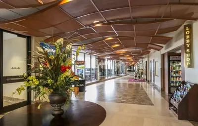a hallway with a vase of flowers on a table at Robert Treat Hotel in Newark