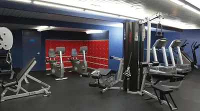 a gym with several treadmills and cardio machines at Robert Treat Hotel in Newark