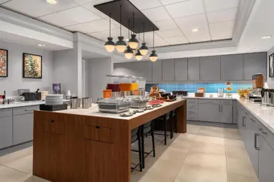 a large kitchen with a large island in the middle at Homewood Suites by Hilton Newtown - Langhorne, PA in Newtown