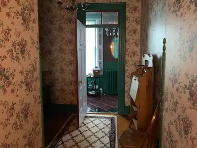 a hallway with an open door to a room at Susquehanna Manor Inn in Marietta