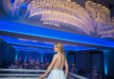 a woman in a white dress walking on a stage at Homewood Suites By Hilton Allentown Bethlehem Center Valley in Center Valley