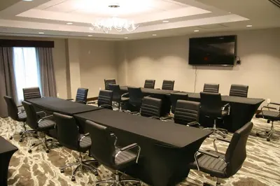a conference room with a long table and chairs at Homewood Suites By Hilton Allentown Bethlehem Center Valley in Center Valley