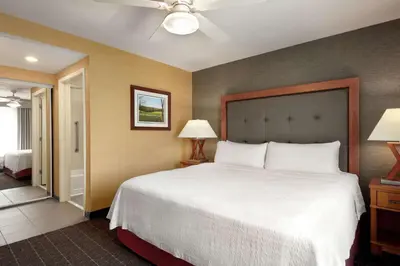 a bedroom with a large white bed and two lamps at Homewood Suites by Hilton Allentown-West/Fogelsville in Fogelsville