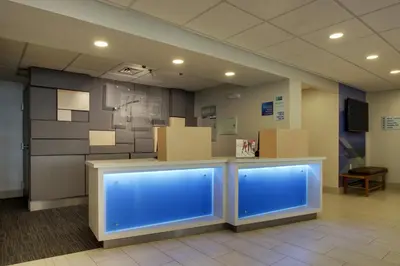 an empty room with a counter with blue lights at Holiday Inn Express Voorhees/ Mt. Laurel by IHG in Voorhees