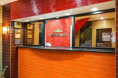 a red brick building with a restaurant sign on it at Howard Johnson by Wyndham North Plainfield in North Plainfield