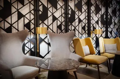 a room with chairs and a table and a wall at Courtyard by Marriott New York Manhattan / Soho in New York