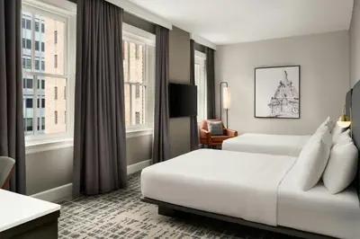 a hotel room with two beds and a television at Courtyard by Marriott Philadelphia Downtown in Philadelphia