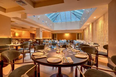 a large dining room with tables and chairs at Four Points by Sheraton Manhattan SoHo Village in New York