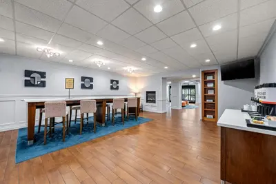 a large room with a table and chairs in it at Hampton Inn Bordentown in Bordentown
