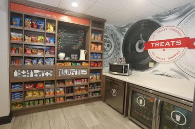 a grocery store with a treats counter in a store at Hampton Inn Owego in Owego