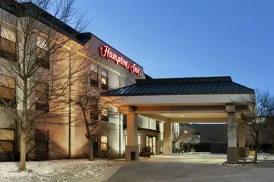 a building with a sign on the front of it at Hampton Inn Binghamton/Johnson City in Binghamton