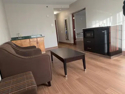 a living room with a couch and a coffee table at Days Inn by Wyndham Budd Lake in Budd Lake