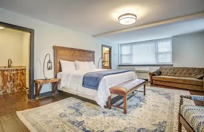 a bedroom with a bed and a couch at Allenberry Resort in Carlisle