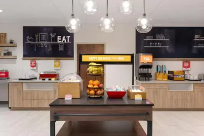 a kitchen with a table with fruit on it at Hampton Inn Bloomsburg in Bloomsburg