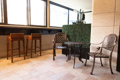 a group of chairs and tables in a restaurant at The Allen Hotel in New York