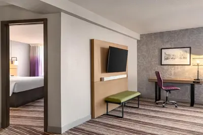 a hotel room with a bed and a desk at Holiday Inn Philadelphia Arpt-Stadium Area by IHG in Philadelphia