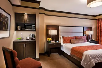 a hotel room with a bed and a chair at The Pearl Hotel in New York