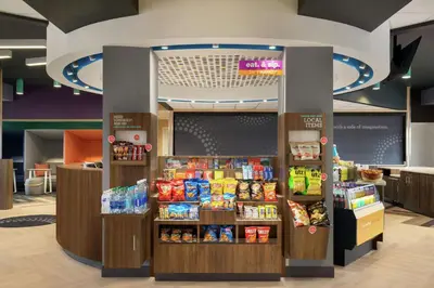 a grocery store aisle with food and drinks at Tru By Hilton York Pa in York
