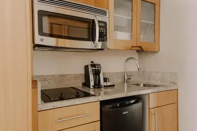 a kitchen with a sink and a microwave at The Jewel Hotel, New York in New York