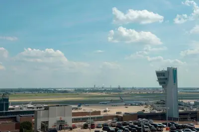 a view of an airport with a parking lot and planes at Philadelphia Airport Marriott in Philadelphia
