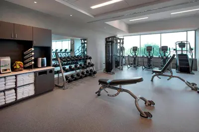 a gym with several exercise equipment in a room at Philadelphia Airport Marriott in Philadelphia