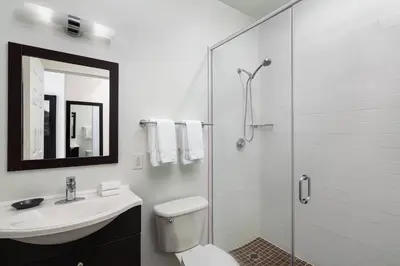 a bathroom with a toilet and a sink and a shower at Residence Inn by Marriott Philadelphia Center City in Philadelphia